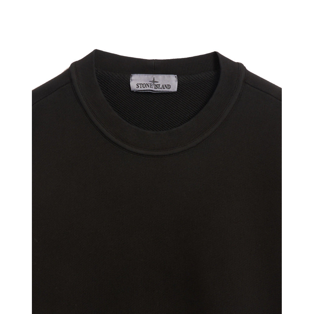 Detail of the ribbed crew neckline on the Stone Island organic cotton sweatshirt.
