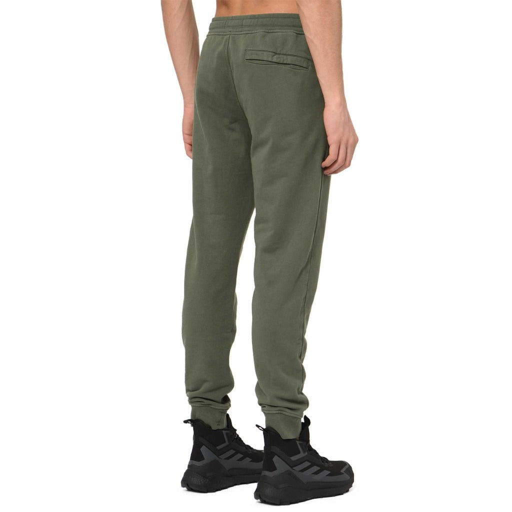 Back view of Stone Island green slim fit fleece sweatpants with back pocket.
