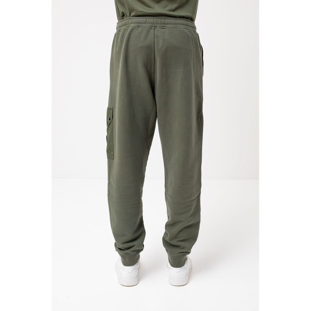Side profile of the Stone Island green cotton regular fit tracksuit trousers.
