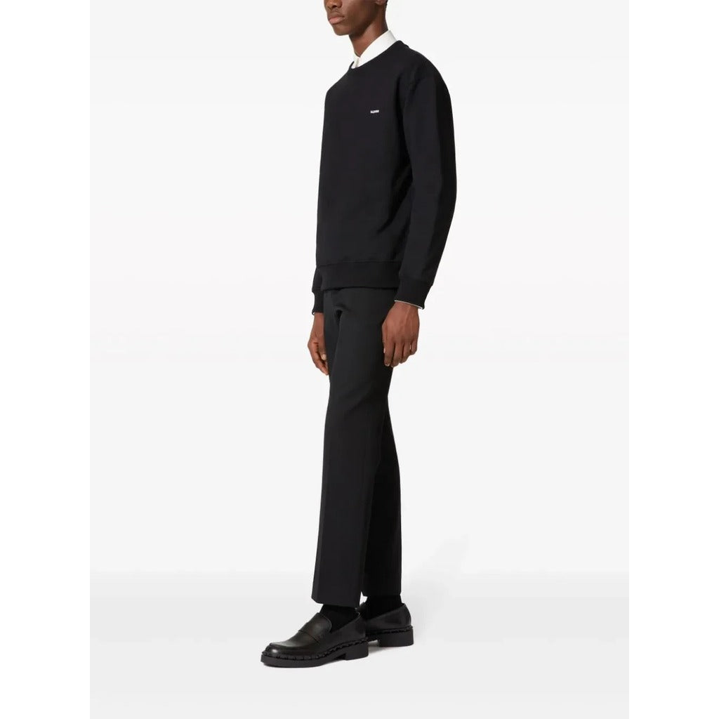 Detail showing the drop shoulder design of the Valentino Garavani black sweatshirt