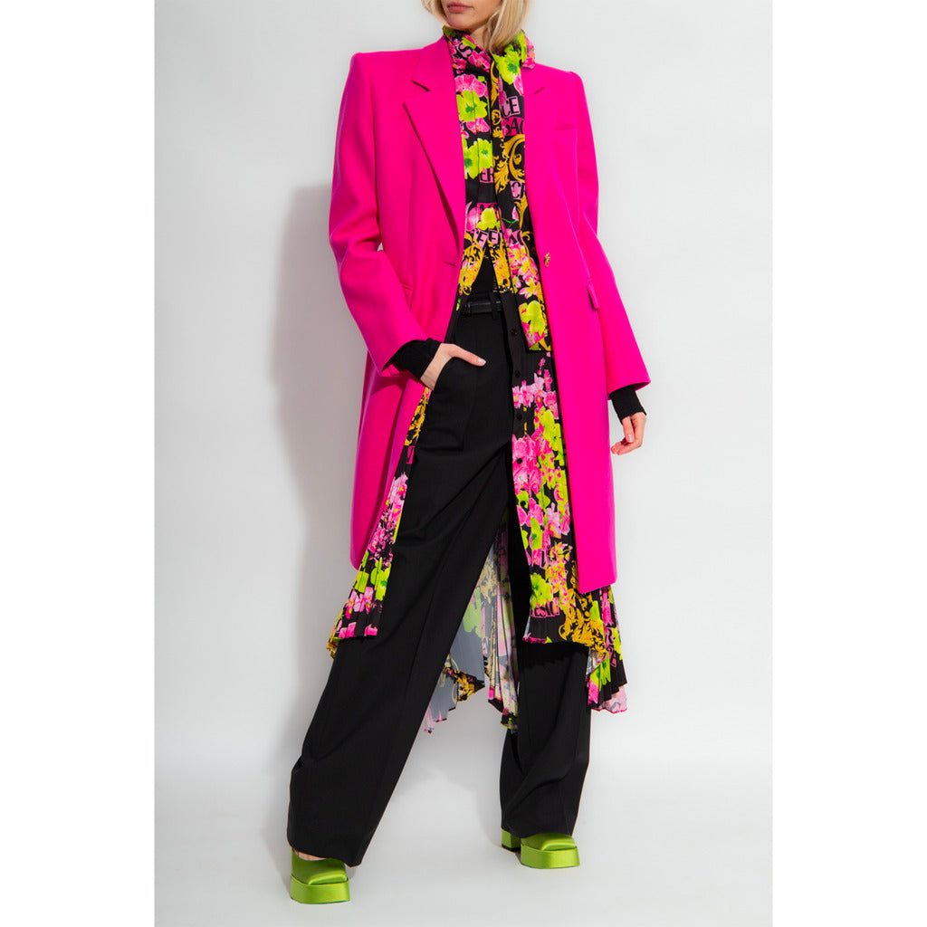 Model wearing the Versace fuchsia pink viscose long coat.
